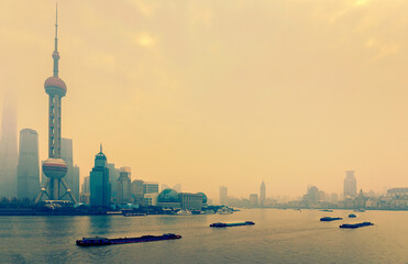 Shanghai skyline in sunny morning with cloud sky, misty and Huangpu river cityscape view