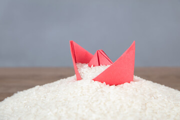 Ripe rice and paper boat