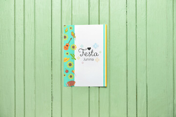 Greeting card for Festa Junina (June Festival) on color wooden background