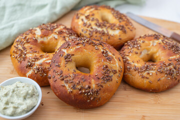 freshly baked whole grain bagels. heap of fresh baked bagels