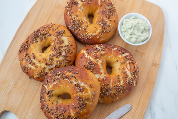 freshly baked whole grain bagels. heap of fresh baked bagels