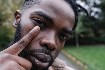 Tear Tattoo Finger Under Eye Concept 