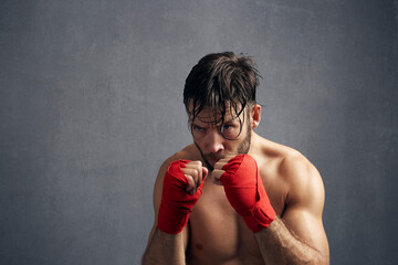 Portrait Of Exhausted Kickboxer Training