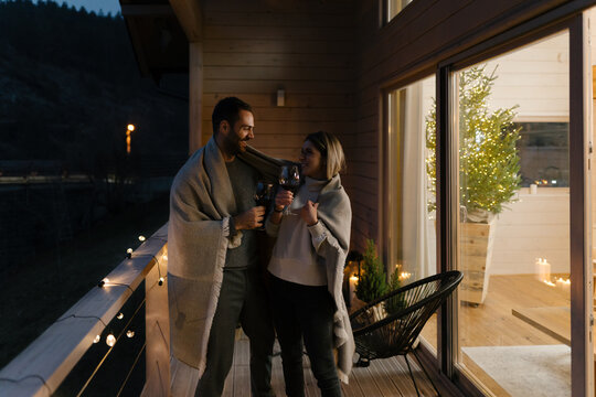 Couple hangout on a terrace at Christmas evening