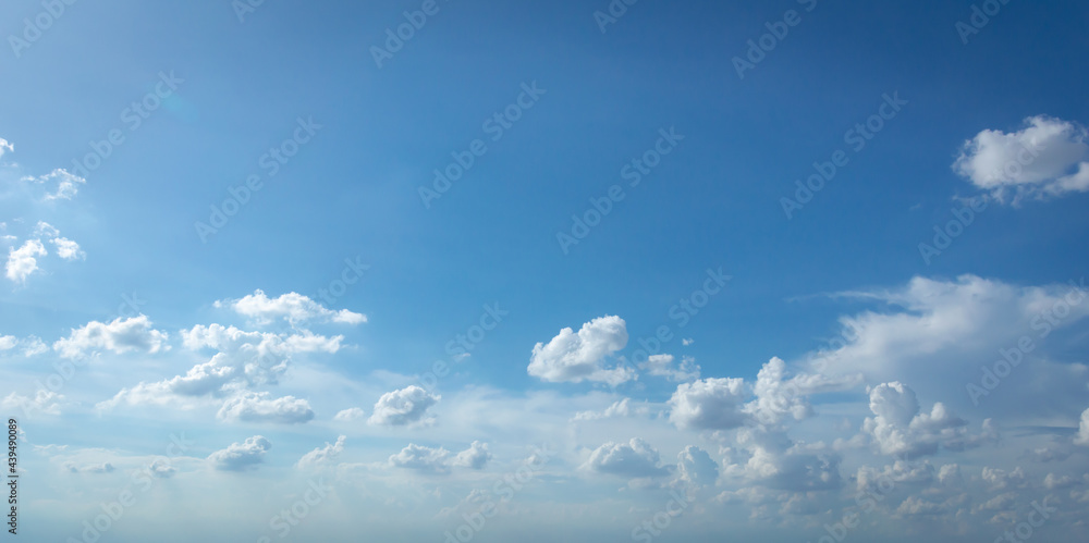 Wall mural blue sky background with tiny clouds. panorama white fluffy clouds in the blue sky.beautiful vast bl