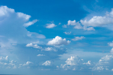 blue sky background with tiny clouds. panorama white fluffy clouds in the blue sky.Beautiful vast blue sky with amazing cloud background.Wide sky panorama with scattered cumulus clouds.