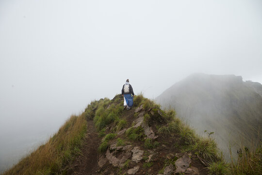 Girl walking on top of a volcano