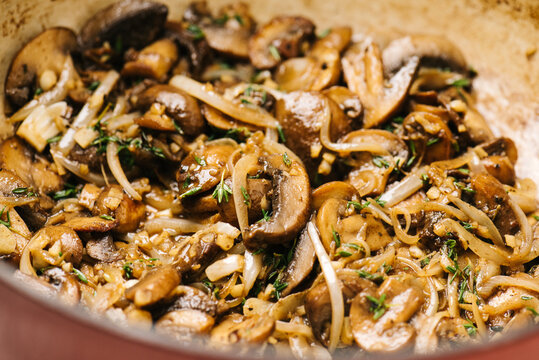 Sauteeing onions and mushrooms for a beef stroganoff recipe