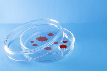 Medicine. A virus in a petri dish on a blue background. Elements of a bitmap drawing. A pandemic.