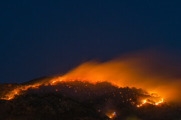 long exposure of a wildfire in a mountain forest of mexico at nigth