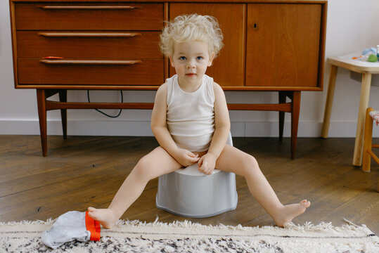 Baby boy potty training indoors