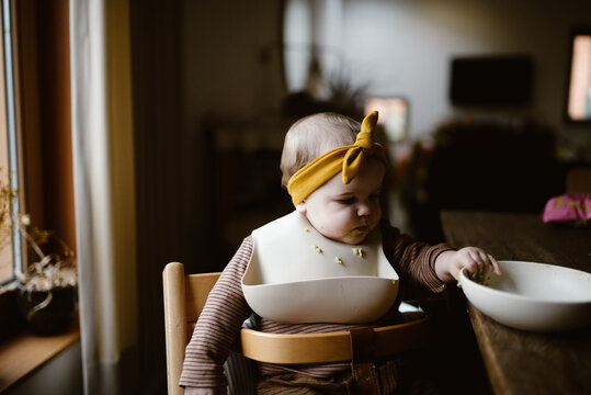 little baby girl having solid foods for lunch/dinner