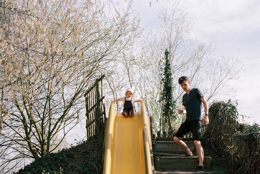 father and son having fun on a playground