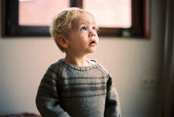 toddler boy looking up