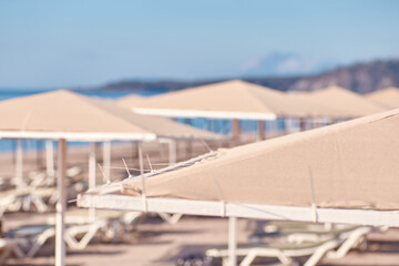 Beach umbrella or parasol on sunny weather near Mediterranean Sea. Protective concept. High quality photo