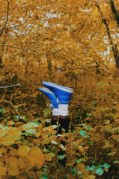 Blue Sneaker Shoes and Fall Nature with Yellow Tones