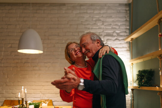 A Senior Couple Celebrating Christmas at Home - Powered by Adobe
