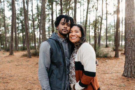 A man and woman embracing each other - pregnancy announcement 