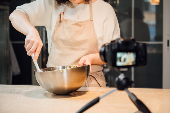 asian woman baking at home