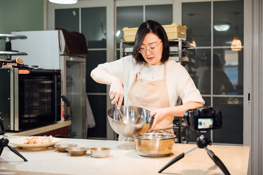 asian woman baking at home