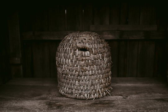 Authentic beehive in shabby timber storage
