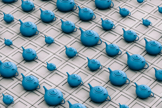 Blue teapot on grey background