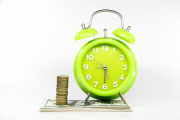 coin towers, banknotes and alarm clocks. financial concepts