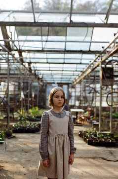 Beautiful Sad Girl In A Greenhouse