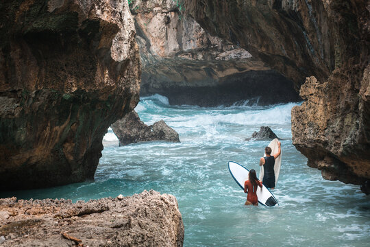 surfers go swimming in the ocean