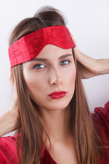 Young woman with red lips, with mask for sleep, young lady pouting