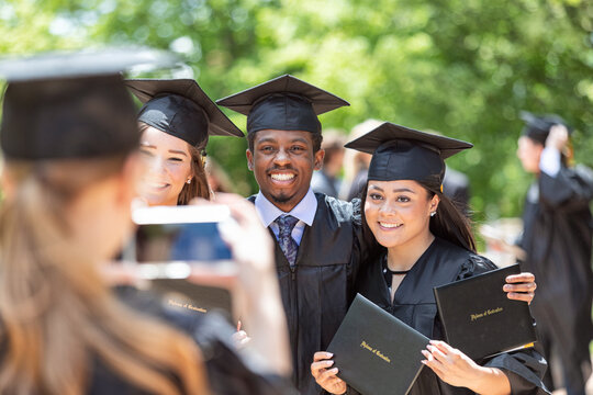 Grad: Three Friends Take Group Photo With Diplomas