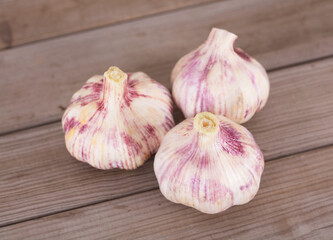 Three heads of fresh garlic on the table