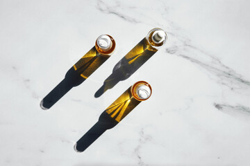 CBD Oil Bottles in Harsh Sunlight