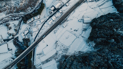 The Aerial View Of Small Japanese Village After Snow Day