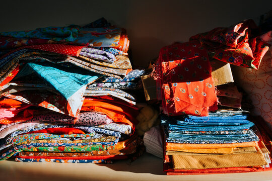 A variety of colored fabrics for needlework.