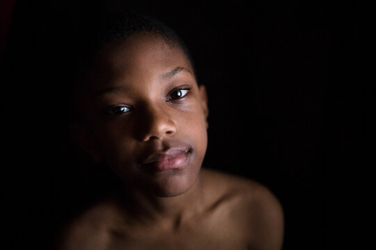 Boy looks seriously into camera 