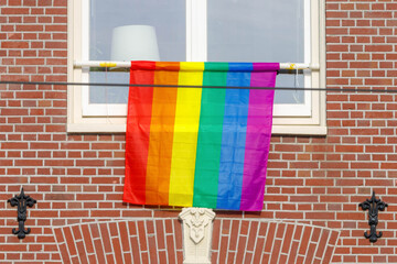 Window rainbow, Colourful rainbow flag hang outside the building, The Symbol of gay, lesbian,...