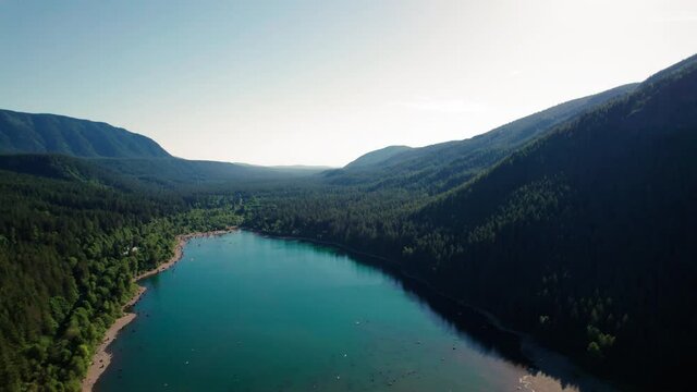 Beautiful Washington Nature Aerial with Turquoise Color Mountain Lake Surrounded by Trees