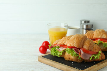 Concept of tasty eating with croissant sandwich, space for text