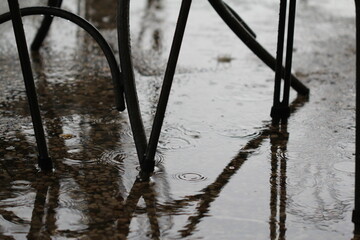 Chair in the rain reflection