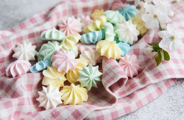 Close-up delicious meringue cookies pastel colors