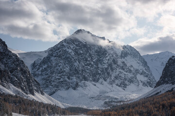 The cold mountainous region of Altai, Russia, has stunning snow-capped mountains. Popular travel destinations in Russia.