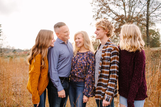 Happy Family with Teenagers Looking at Each Other
