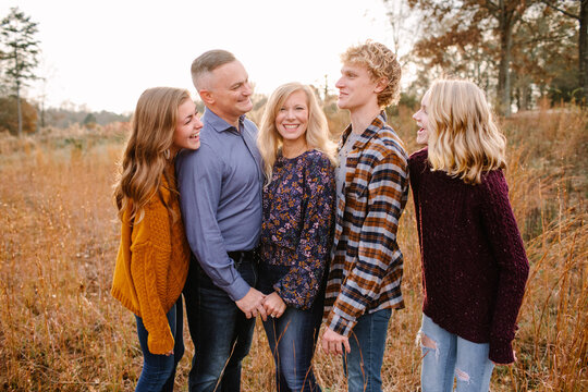 Happy Family with Teenagers Looking at Each Other