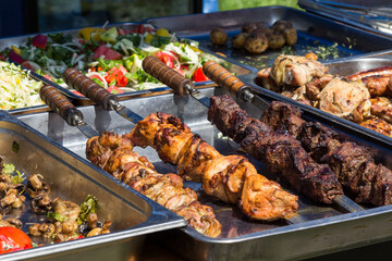 Fried meat on skewer. Street food.