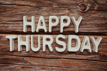 Happy Thursday text message on wooden background