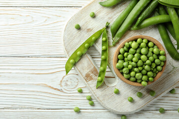 Fresh green pea on white wooden table
