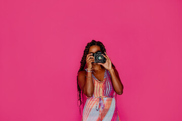 Black female photographer with long hair 