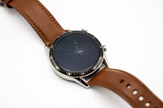 Smart watch with broken display screen isolated on white background
