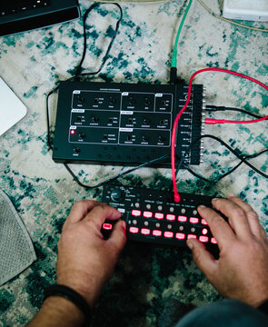 hand adjusting a sequencer